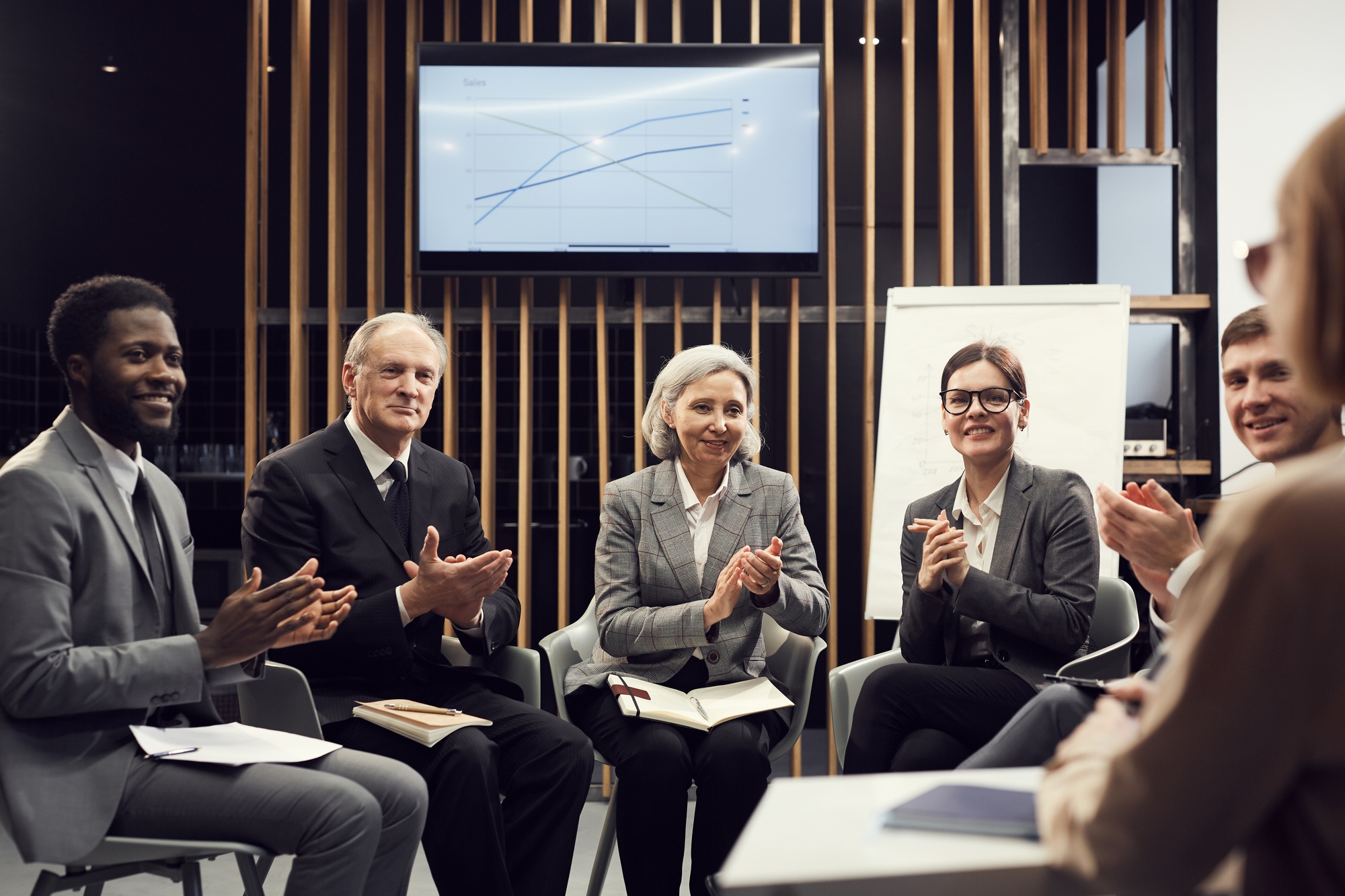 Small group of business people at course